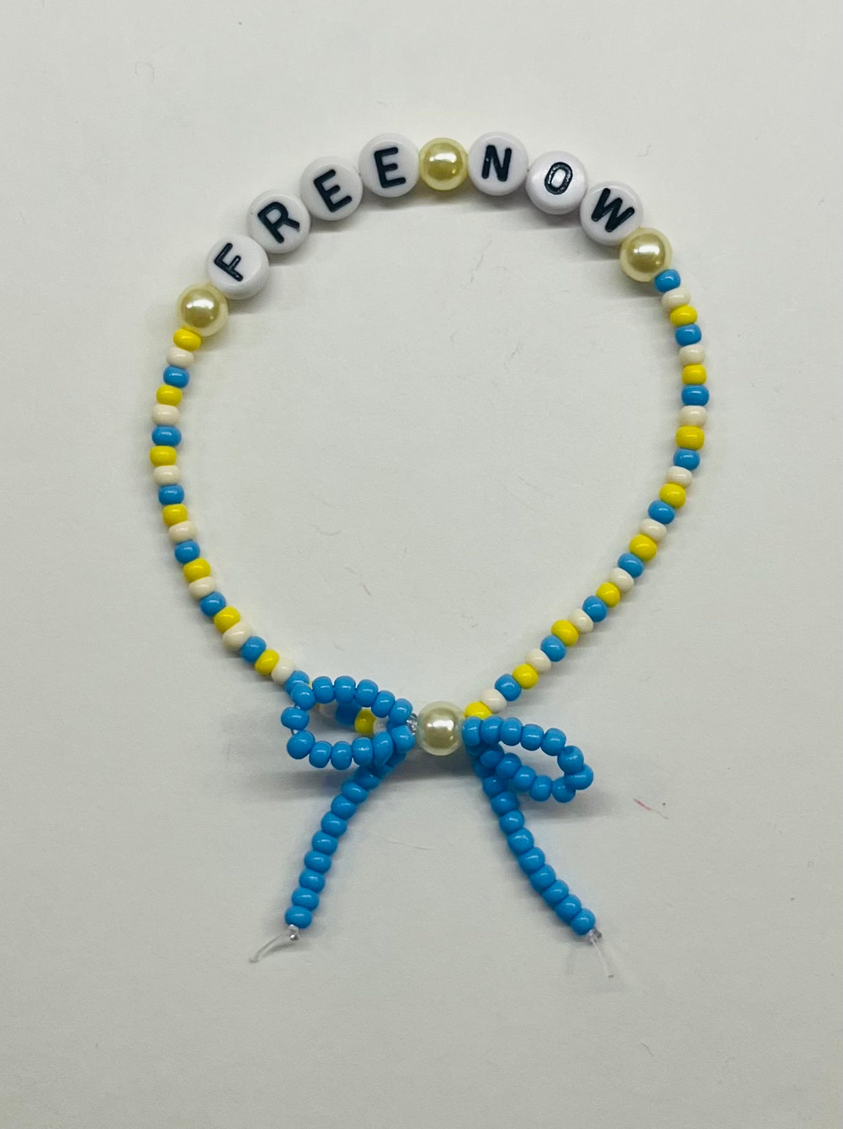 “Free Now” Beaded Bow Bracelet